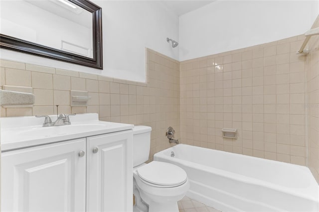 5201 Van Aken Dr, Orlando, FL 32808 - bathroom featuring vanity, tile walls, toilet, a wainscoted wall, and tub / shower combination