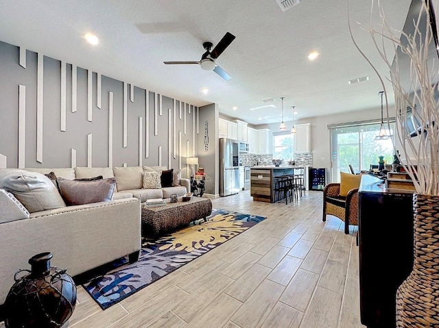 11826 Sky Acres Ter, Bradenton, FL 34211 - living room featuring a ceiling fan, wood finish floors, and recessed lighting
