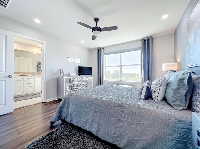 11826 Sky Acres Ter, Bradenton, FL 34211 - bedroom featuring wood finished floors, connected bathroom, a ceiling fan, and recessed lighting