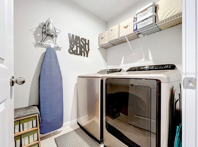 11826 Sky Acres Ter, Bradenton, FL 34211 - laundry room featuring washer and clothes dryer and light tile patterned flooring