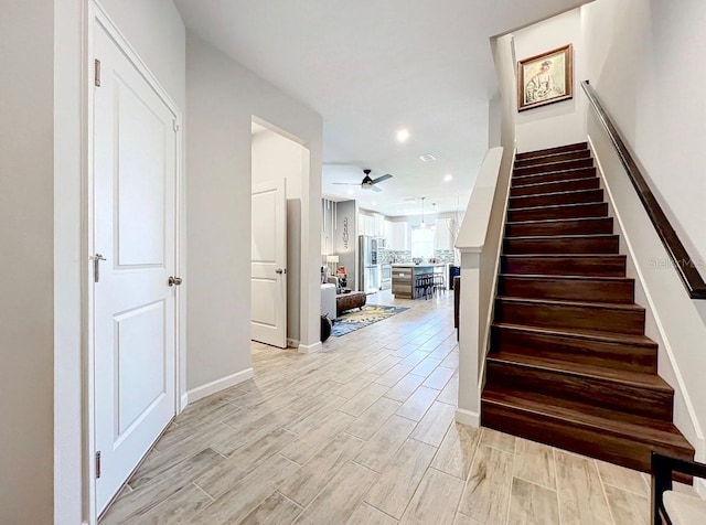 11826 Sky Acres Ter, Bradenton, FL 34211 - stairway featuring ceiling fan, wood finished floors, and recessed lighting