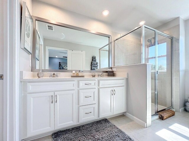 11826 Sky Acres Ter, Bradenton, FL 34211 - bathroom with double vanity, a stall shower, and tile patterned flooring