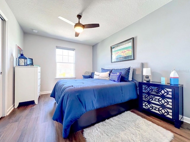 11826 Sky Acres Ter, Bradenton, FL 34211 - bedroom with wood finished floors, a textured ceiling, and a ceiling fan