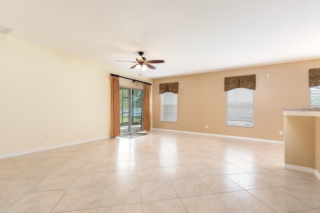 563 Copperdale Ave, Winter Garden, FL 34787 - empty room with light tile patterned flooring, baseboards, and a ceiling fan