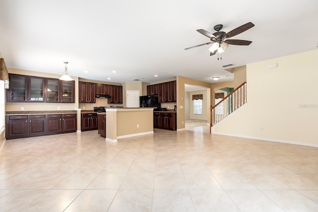563 Copperdale Ave, Winter Garden, FL 34787 - kitchen with a kitchen island, a ceiling fan, freestanding refrigerator, under cabinet range hood, and visible vents