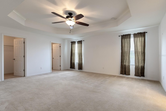 563 Copperdale Ave, Winter Garden, FL 34787 - interior space featuring a tray ceiling, light colored carpet, baseboards, and ornamental molding