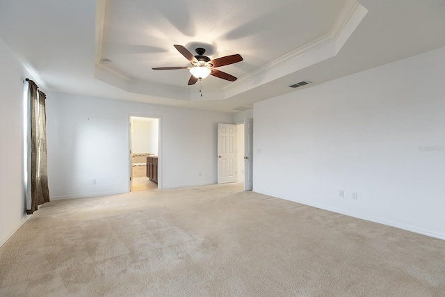 563 Copperdale Ave, Winter Garden, FL 34787 - spare room with visible vents, crown molding, a ceiling fan, a tray ceiling, and light colored carpet