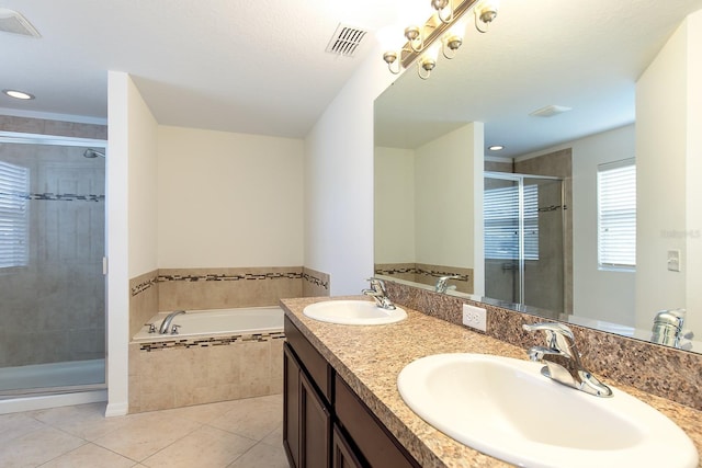 563 Copperdale Ave, Winter Garden, FL 34787 - bathroom with a bath, visible vents, a sink, and tile patterned floors