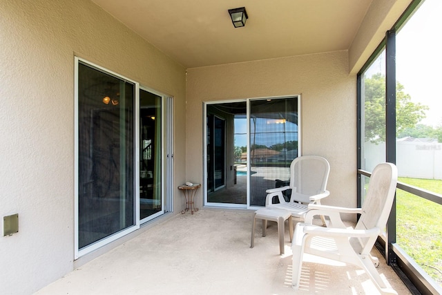 563 Copperdale Ave, Winter Garden, FL 34787 - sunroom / solarium with concrete floors and a textured wall