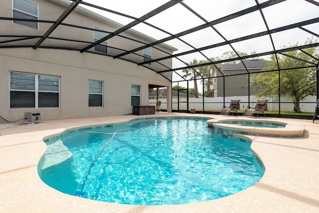 563 Copperdale Ave, Winter Garden, FL 34787 - view of swimming pool featuring glass enclosure, fence, a pool with connected hot tub, and a patio area