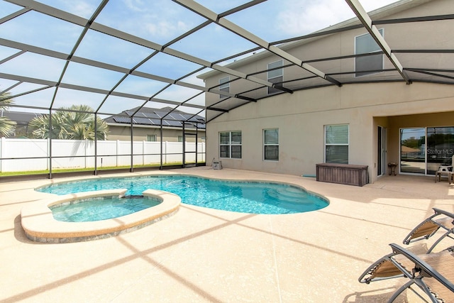 563 Copperdale Ave, Winter Garden, FL 34787 - view of swimming pool featuring a pool with connected hot tub, glass enclosure, fence, and a patio area