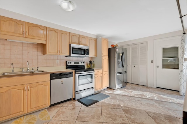 218 Nettlewood Ln, Fern Park, FL 32730 - kitchen featuring light countertops, a sink, tasteful backsplash, light brown cabinets, and stainless steel appliances