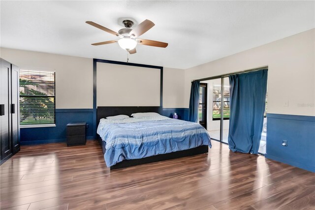 218 Nettlewood Ln, Fern Park, FL 32730 - bedroom with multiple windows, wainscoting, and wood finished floors