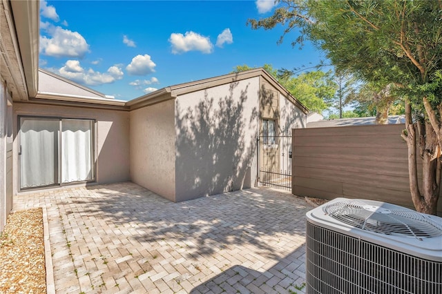 218 Nettlewood Ln, Fern Park, FL 32730 - view of patio featuring central air condition unit, a gate, and fence