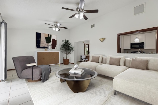 7602 Glenmoor Ln, Winter Park, FL 32792 - living area with visible vents, vaulted ceiling, and light tile patterned floors