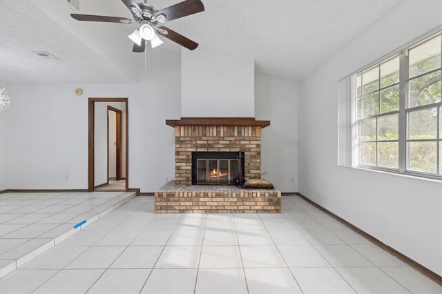7602 Glenmoor Ln, Winter Park, FL 32792 - unfurnished living room with a brick fireplace, lofted ceiling, tile patterned flooring, baseboards, and ceiling fan