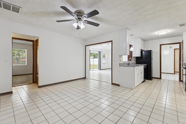 7602 Glenmoor Ln, Winter Park, FL 32792 - kitchen with a ceiling fan, visible vents, a healthy amount of sunlight, and light tile patterned floors