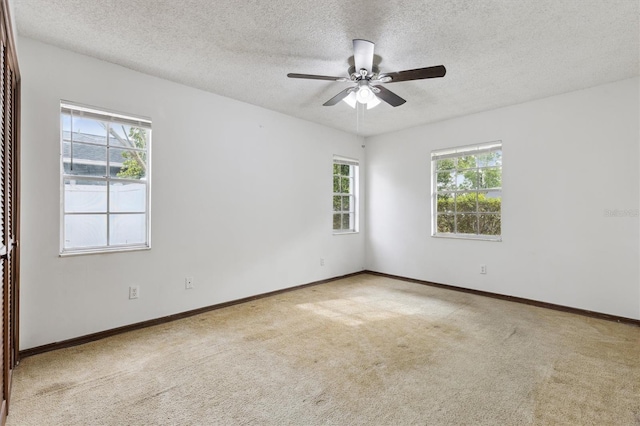 7602 Glenmoor Ln, Winter Park, FL 32792 - unfurnished room with carpet flooring, a ceiling fan, plenty of natural light, and a textured ceiling