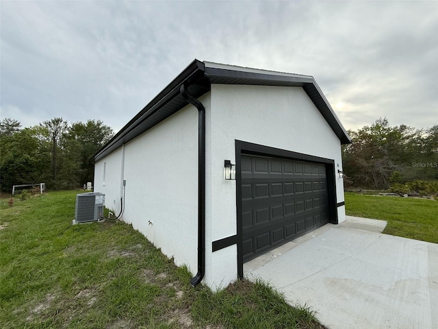 54 Malauka Trak, Ocklawaha, FL 32179 - view of side of property with a yard, central AC, and stucco siding