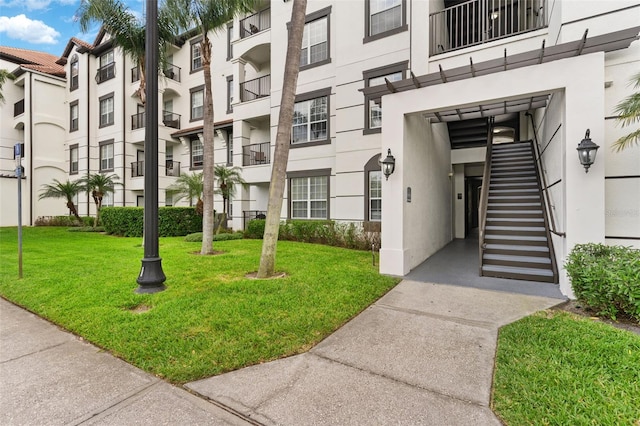 4114 Breakview Dr Unit 11002, Orlando, FL 32819 - view of property featuring a residential view and stairway