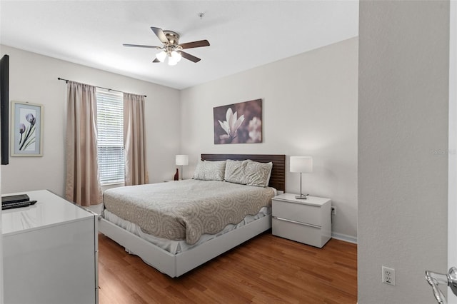 4114 Breakview Dr Unit 11002, Orlando, FL 32819 - bedroom with baseboards, light wood-style flooring, and ceiling fan