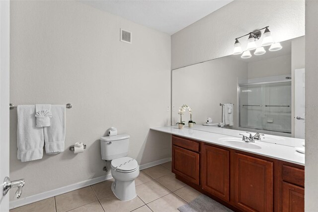 4114 Breakview Dr Unit 11002, Orlando, FL 32819 - bathroom featuring tile patterned floors, toilet, an enclosed shower, and visible vents