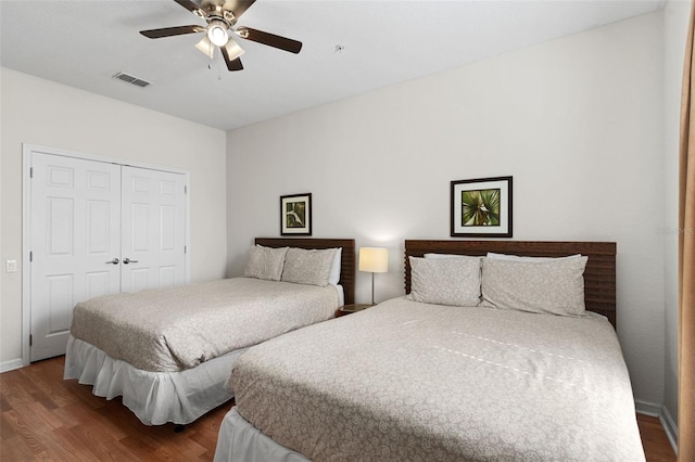 4114 Breakview Dr Unit 11002, Orlando, FL 32819 - bedroom featuring baseboards, ceiling fan, visible vents, a closet, and wood finished floors