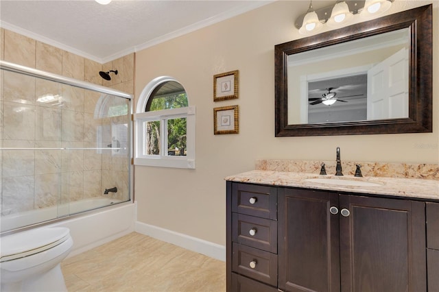 2910 Frontier Dr, Kissimmee, FL 34744 - full bath with vanity, ornamental molding, toilet, shower / bath combination with glass door, and baseboards