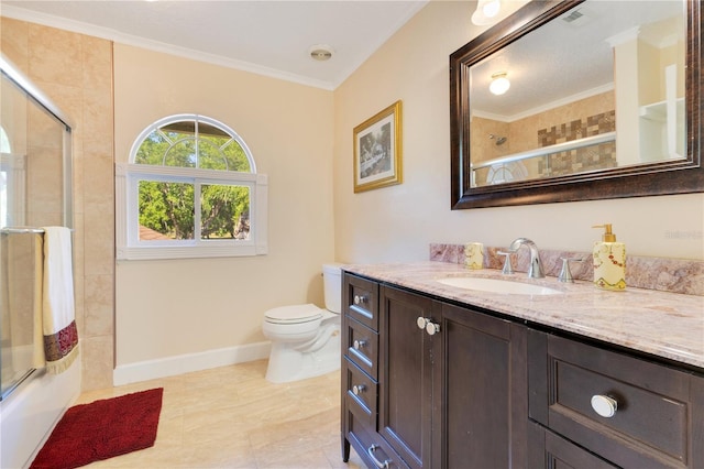 2910 Frontier Dr, Kissimmee, FL 34744 - full bathroom featuring shower / bath combination with glass door, vanity, toilet, baseboards, and ornamental molding
