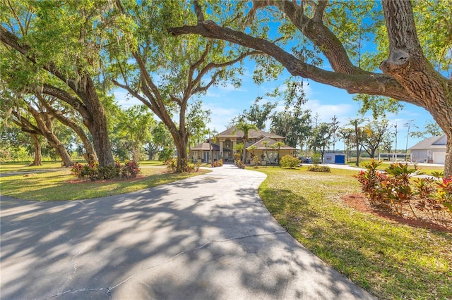 2910 Frontier Dr, Kissimmee, FL 34744 - view of front of property with a front lawn