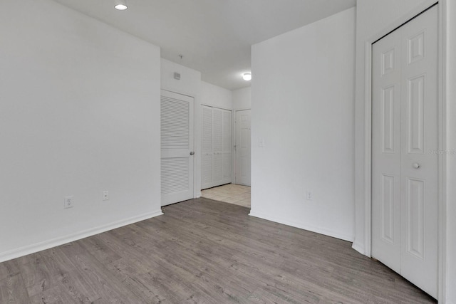 5550 E Michigan St Unit 3325, Orlando, FL 32822 - spare room featuring baseboards and wood finished floors