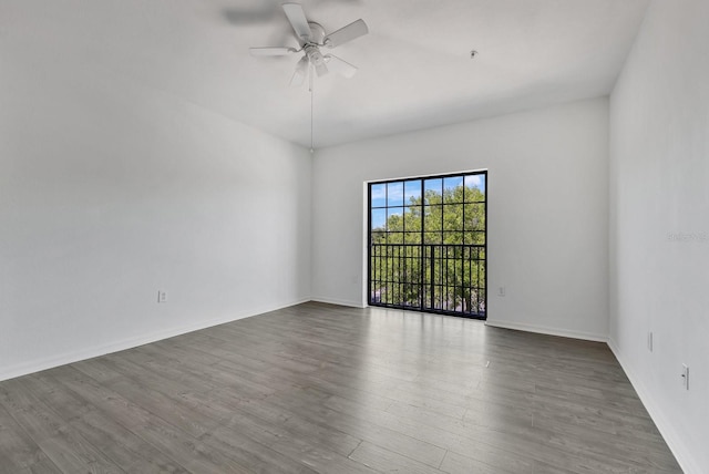 5550 E Michigan St Unit 3325, Orlando, FL 32822 - empty room with baseboards, wood finished floors, and ceiling fan