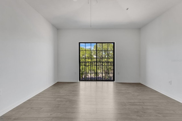 5550 E Michigan St Unit 3325, Orlando, FL 32822 - spare room with baseboards and wood finished floors