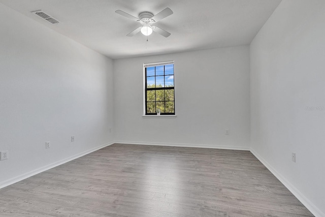 5550 E Michigan St Unit 3325, Orlando, FL 32822 - spare room with baseboards, visible vents, a ceiling fan, and wood finished floors
