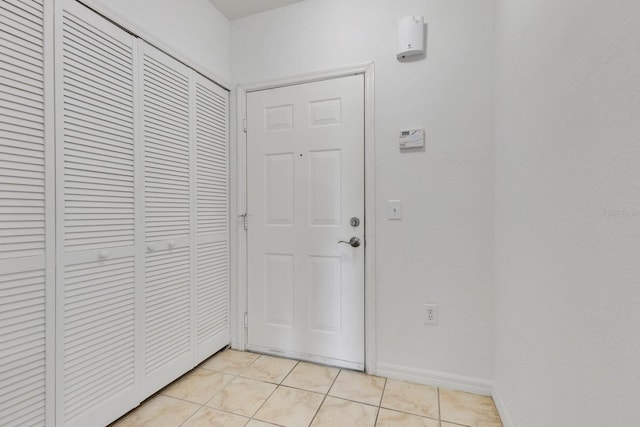 5550 E Michigan St Unit 3325, Orlando, FL 32822 - hallway with baseboards and light tile patterned floors