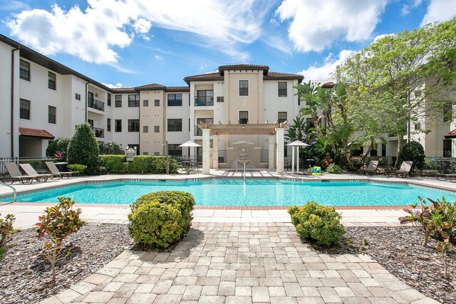 5550 E Michigan St Unit 3325, Orlando, FL 32822 - community pool featuring a patio area
