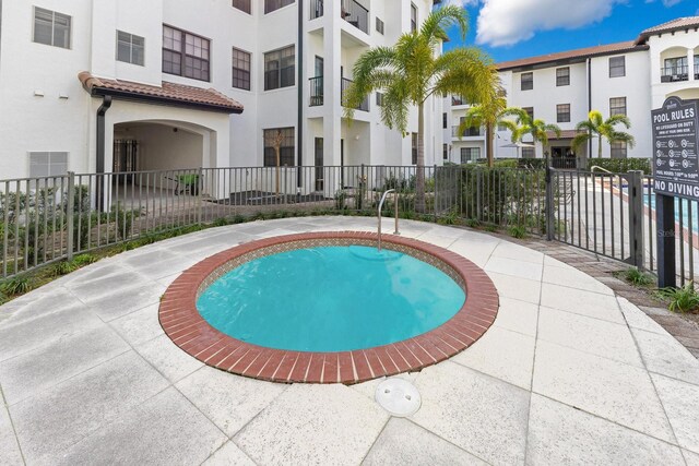 5550 E Michigan St Unit 3325, Orlando, FL 32822 - view of swimming pool with fence