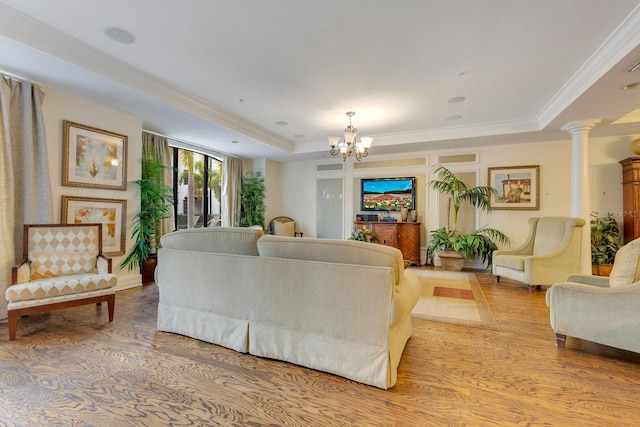 5550 E Michigan St Unit 3325, Orlando, FL 32822 - living room with a tray ceiling, light wood-type flooring, a notable chandelier, and ornamental molding