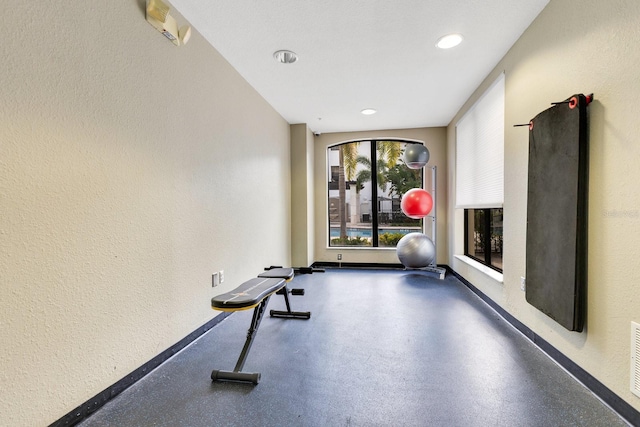 5550 E Michigan St Unit 3325, Orlando, FL 32822 - exercise room with baseboards, visible vents, and a textured wall