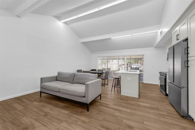 4066 Vanet Ct, Orlando, FL 32822 - living area with baseboards, beamed ceiling, and light wood finished floors