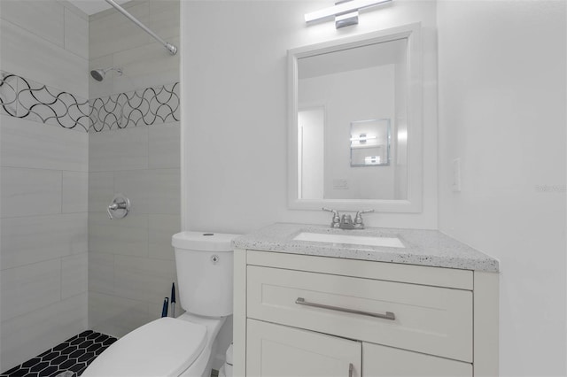 4066 Vanet Ct, Orlando, FL 32822 - bathroom featuring toilet, a tile shower, and vanity
