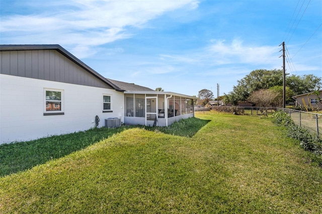 4066 Vanet Ct, Orlando, FL 32822 - view of yard with a fenced backyard, a sunroom, and central AC unit