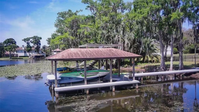 dock featuring boat lift and a water view