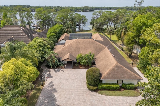 aerial view of property and surrounding area featuring a large body of water