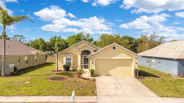 ranch-style house featuring driveway, stucco siding, a garage, and a front yard