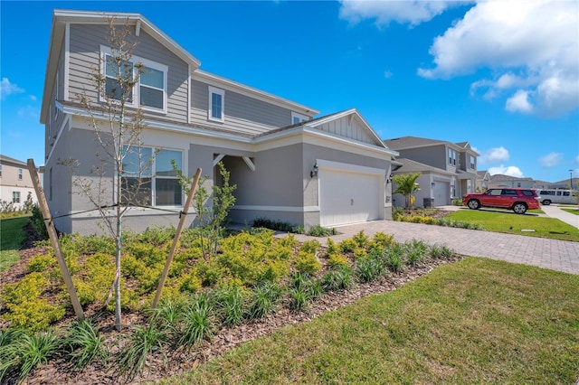 13231 Panama Beach Ct, Orlando, FL 32827 - traditional-style home featuring a garage, decorative driveway, a front yard, and stucco siding