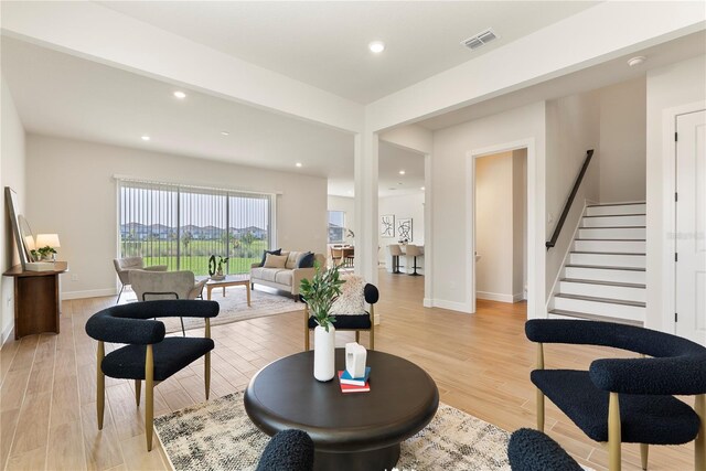 13231 Panama Beach Ct, Orlando, FL 32827 - living area with light wood-style floors, stairway, recessed lighting, and baseboards