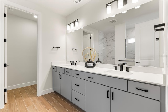 13231 Panama Beach Ct, Orlando, FL 32827 - full bath with double vanity, baseboards, wood finish floors, and recessed lighting