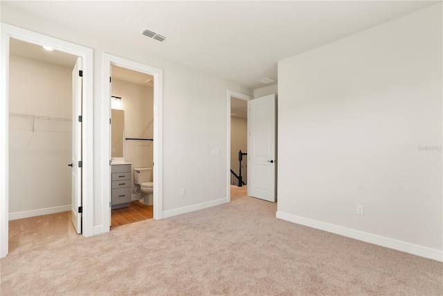 13231 Panama Beach Ct, Orlando, FL 32827 - unfurnished bedroom with carpet, a spacious closet, baseboards, and a closet