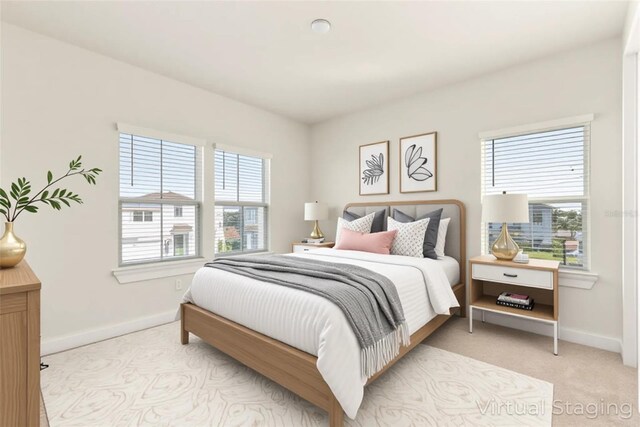 13231 Panama Beach Ct, Orlando, FL 32827 - bedroom with multiple windows, baseboards, and light carpet